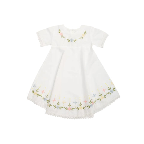 An embroidered cotton children's nightie with floral details at the neck and hem