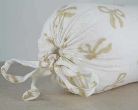 bolster cushion taupe bow print on white background