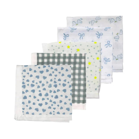 A collection of white and blue heart-patterned muslin cloths with a generous satin trim, displayed folded on a flat surface.