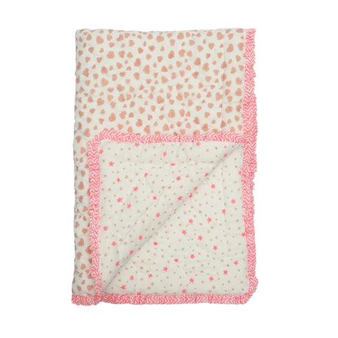 Single quilt with pink and white pattern on a white background
