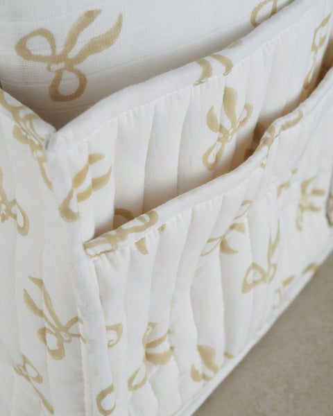 close up of quilted nursery caddy in taupe